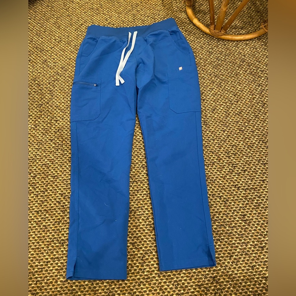 Women’s Figs scrub pants in royal blue.